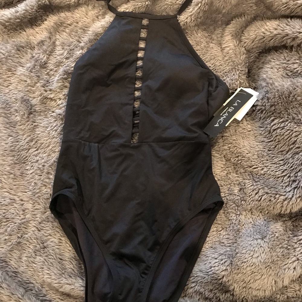 One piece bathing suit, size 8, New with tags